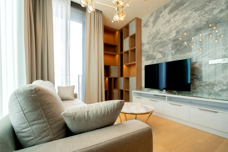 Book-matched marble-look slab TV wall